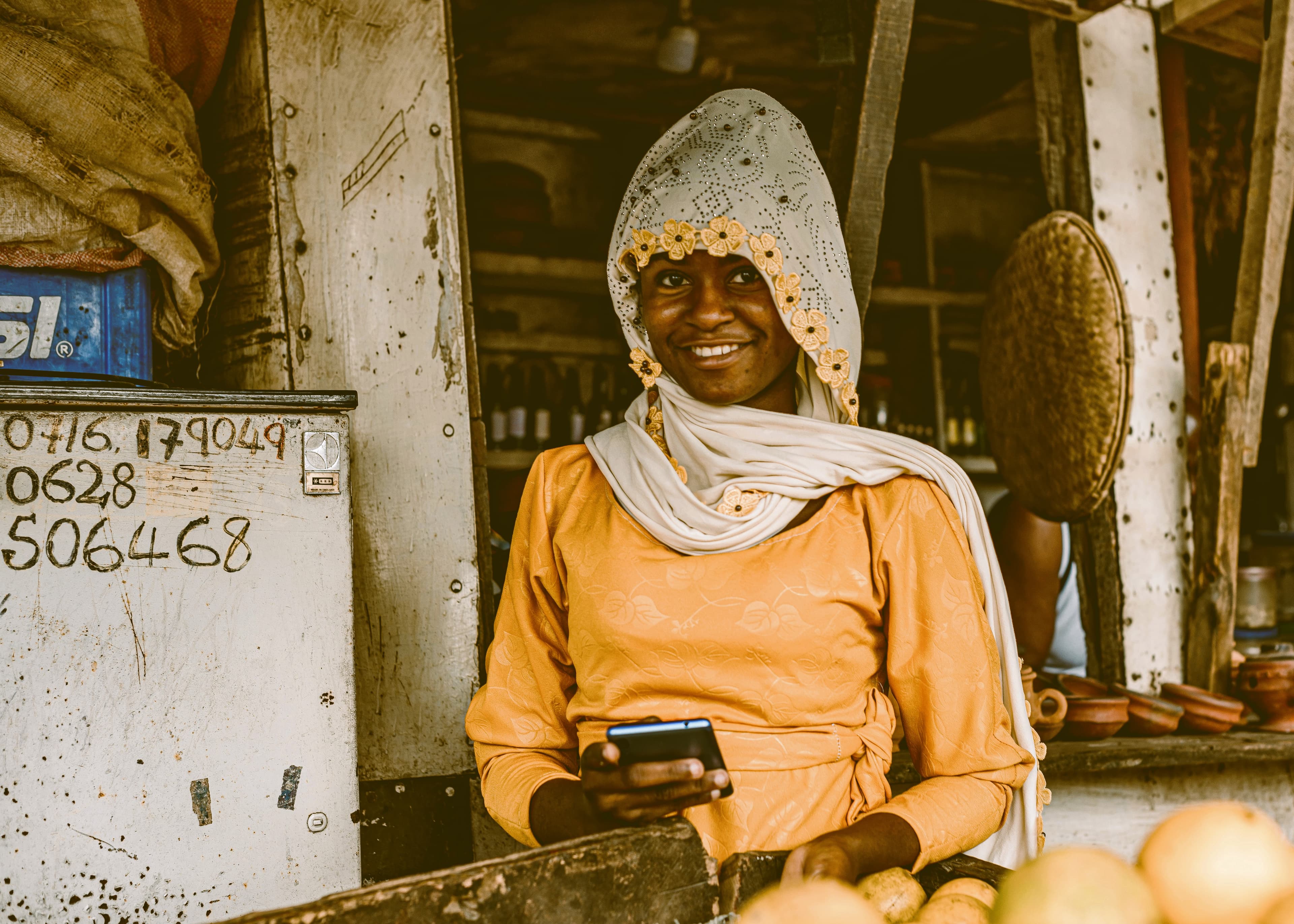 Market trader selling mangoes